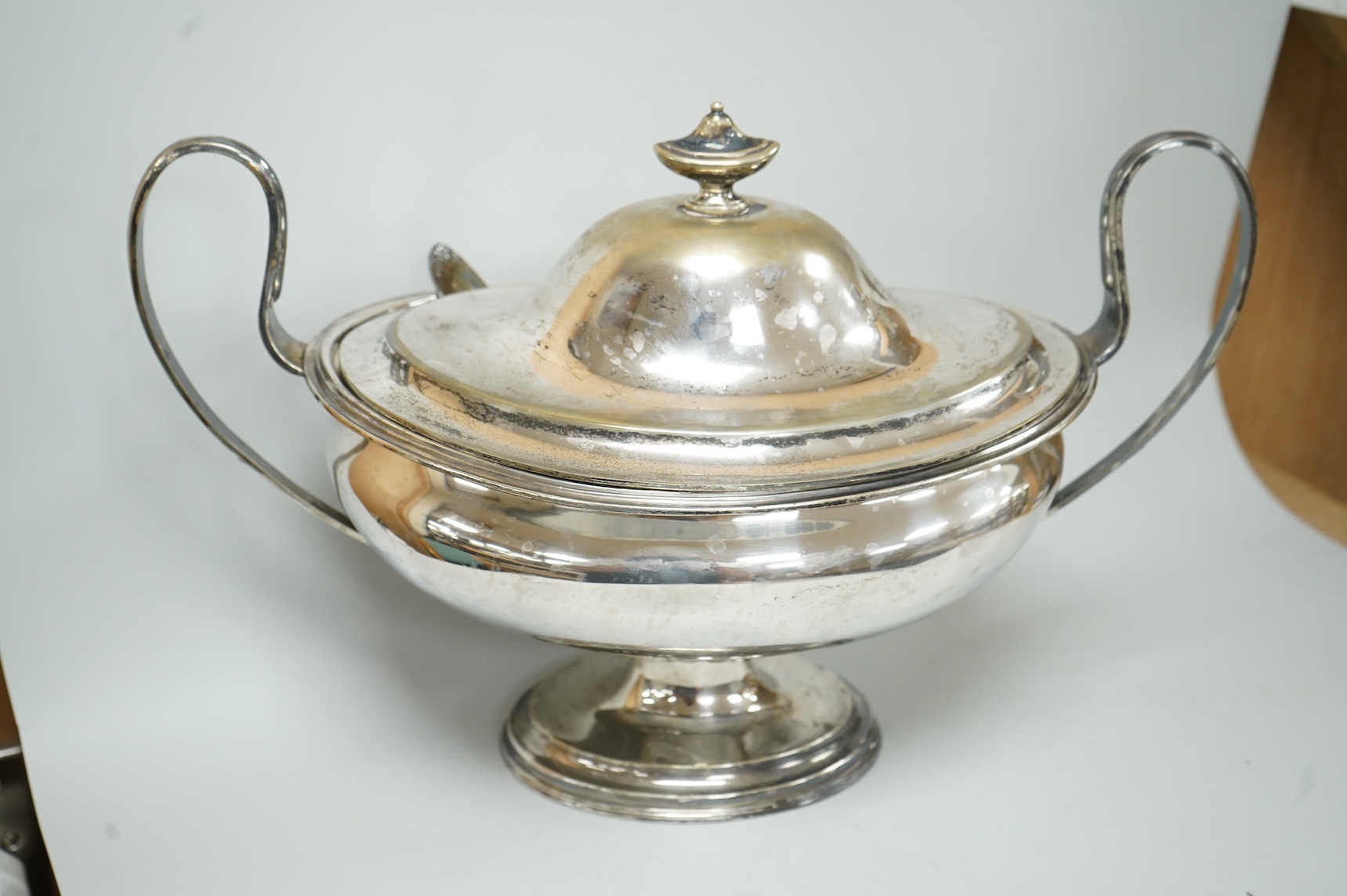 A late Victorian silver mounted claret jug (lacking cover), Holland, Son & Slater, London, 1882, height 21.1cm, together with a sterling sauce ladle, a plated two handled oval pedestal soup tureen and a cased set of six